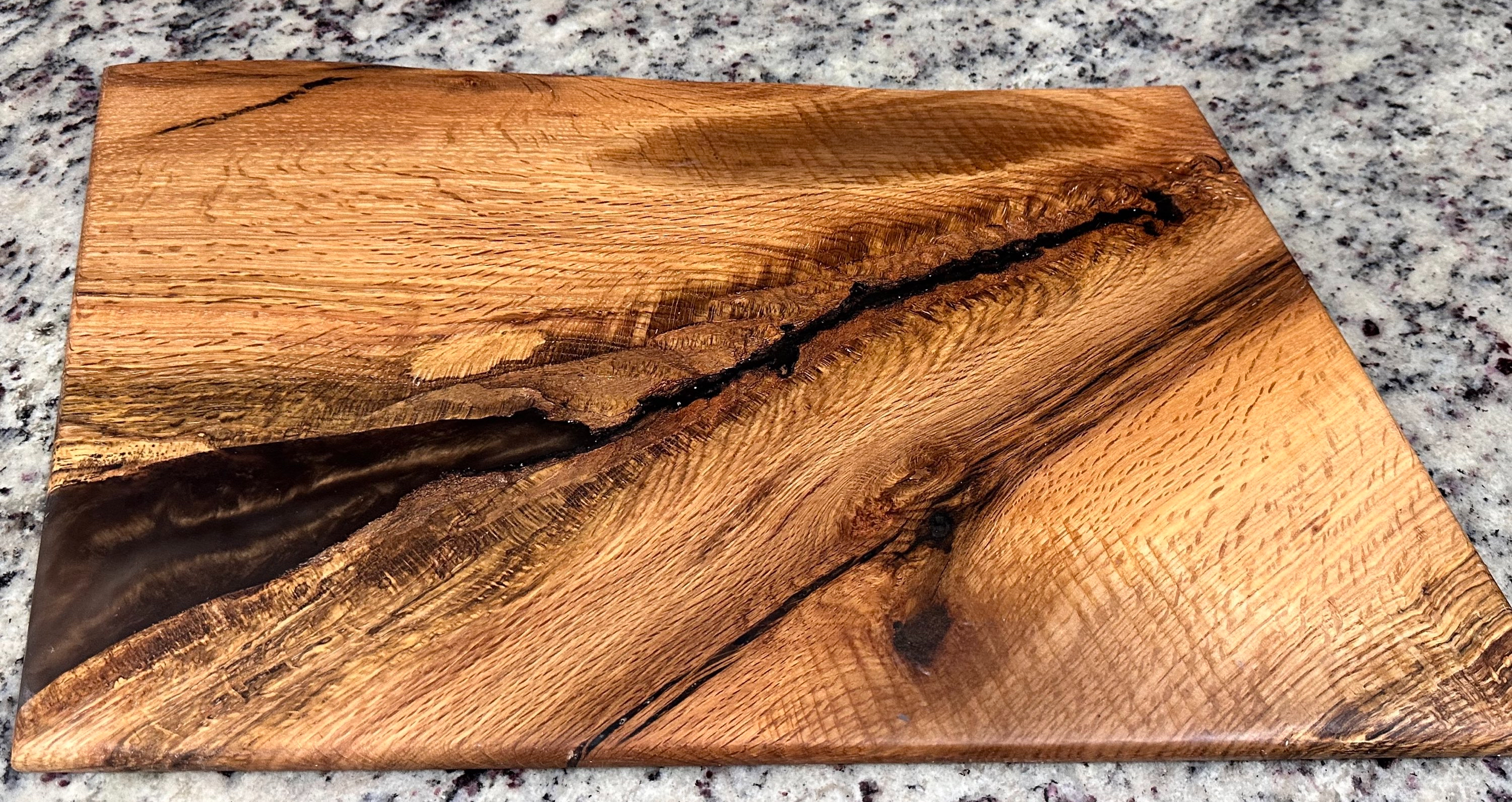 A handcrafted wood and resin board in the Rustic Carolina Creations workshop